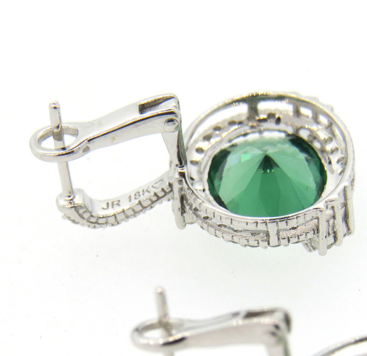 18k white gold earrings, crafted by Judith Ripka, featuring green quartz gemstones, surrounded with approximately 0.60ctw in diamonds. Earrings measure 22mm x 17mm. Marked 18k and JR. Weight - 6.3 grams