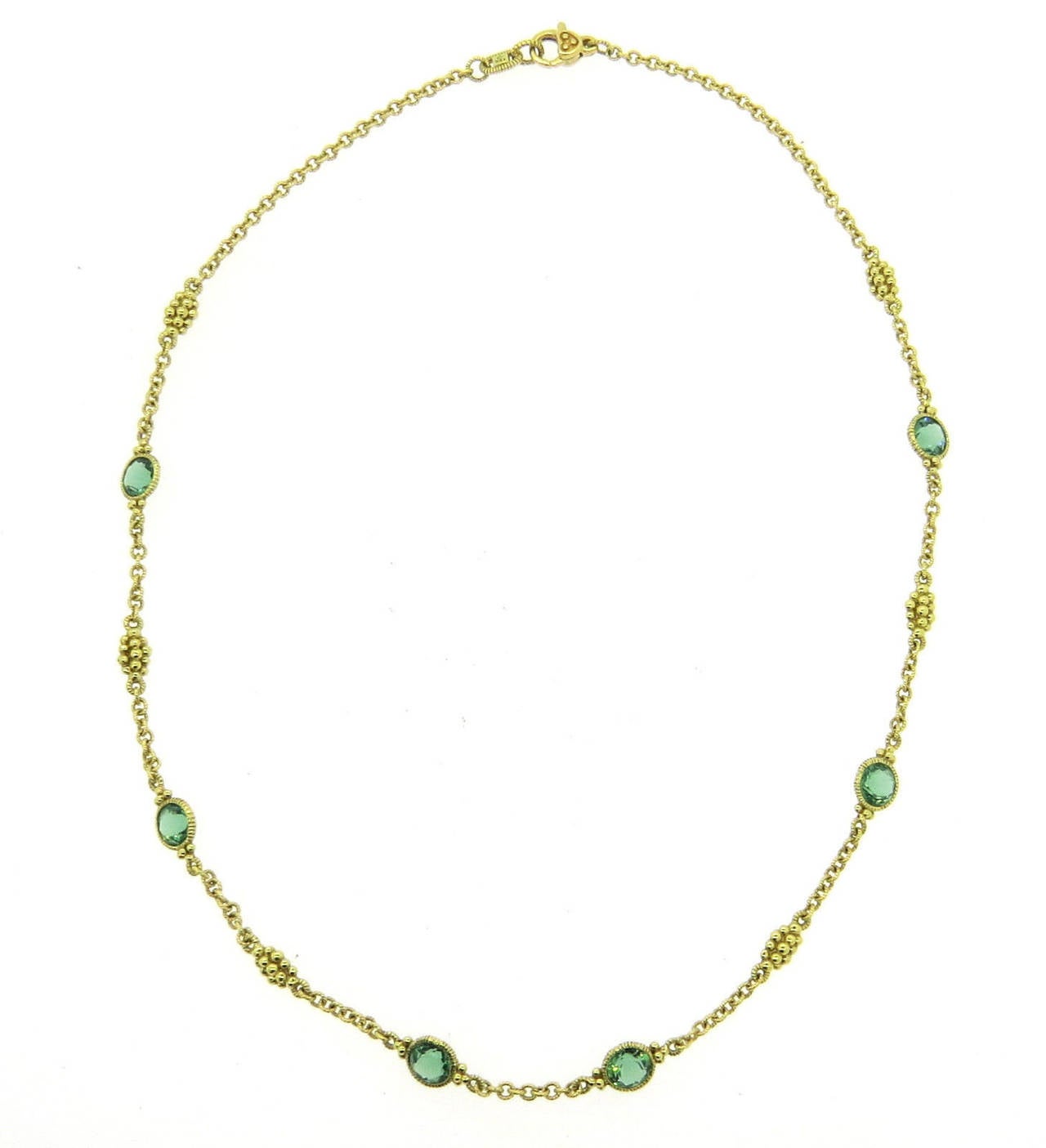 18k gold necklace, crafted by Judith Ripka, featuring green quartz stations. Necklace is 17
