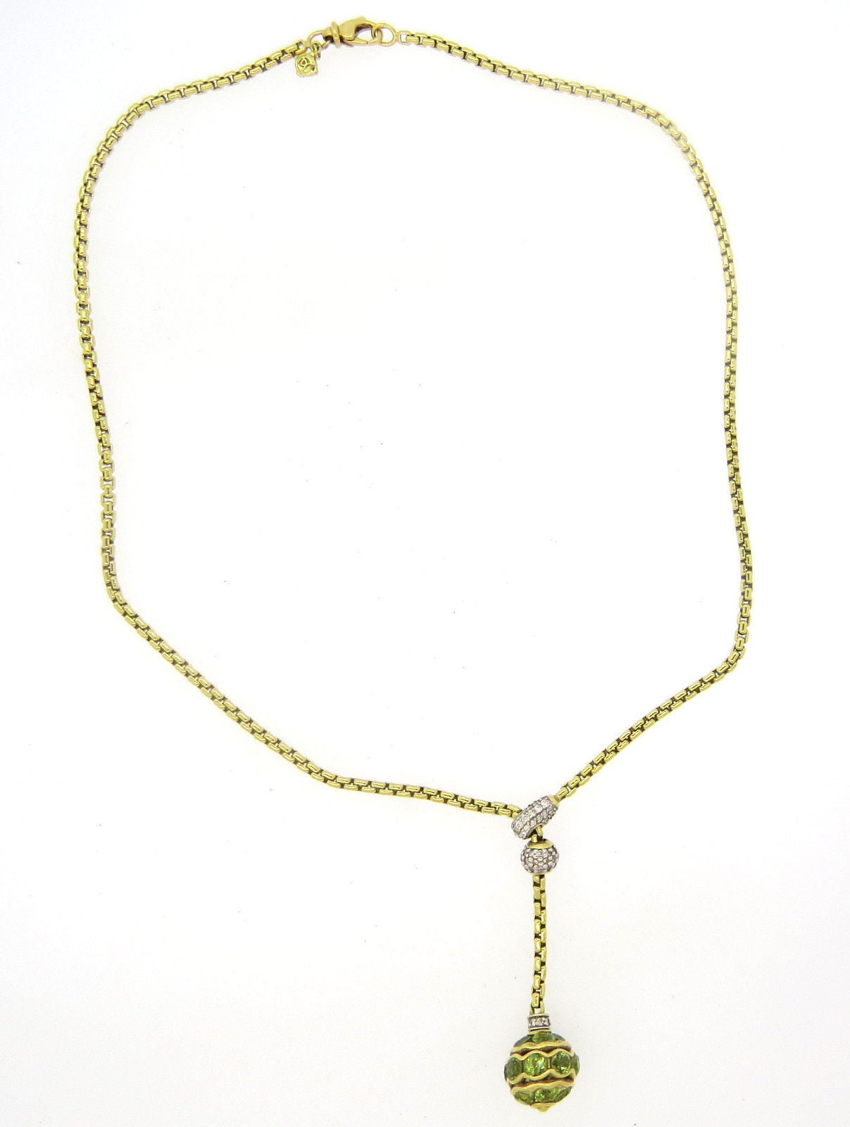 18k gold lariat necklace with ball pendant, crafted by David Yurman, featuring peridots and diamonds. Necklace is 17