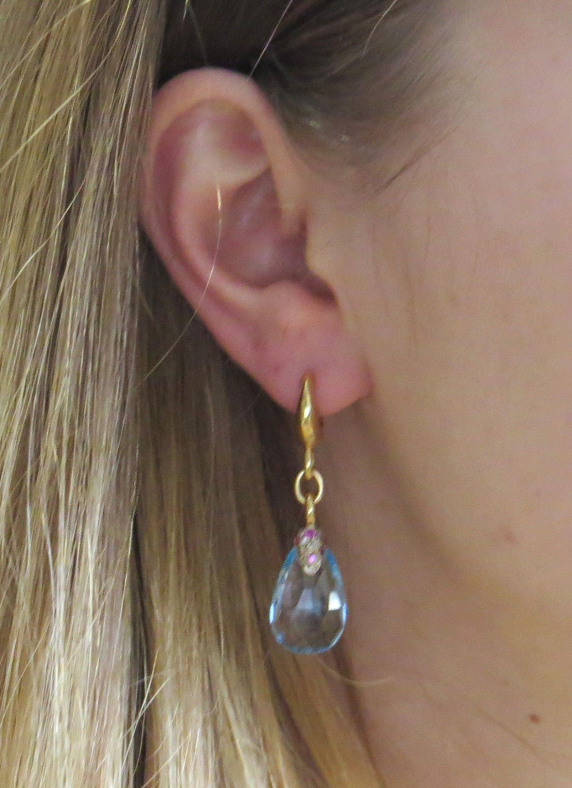 18k gold drop earrings by Pomellato, designed for Pin Up collection, featuring blue topaz teardrops, set with diamonds and sapphires. Earrings measure 47mm x 13mm. Marked Pomellato and 750. Weight - 16 grams