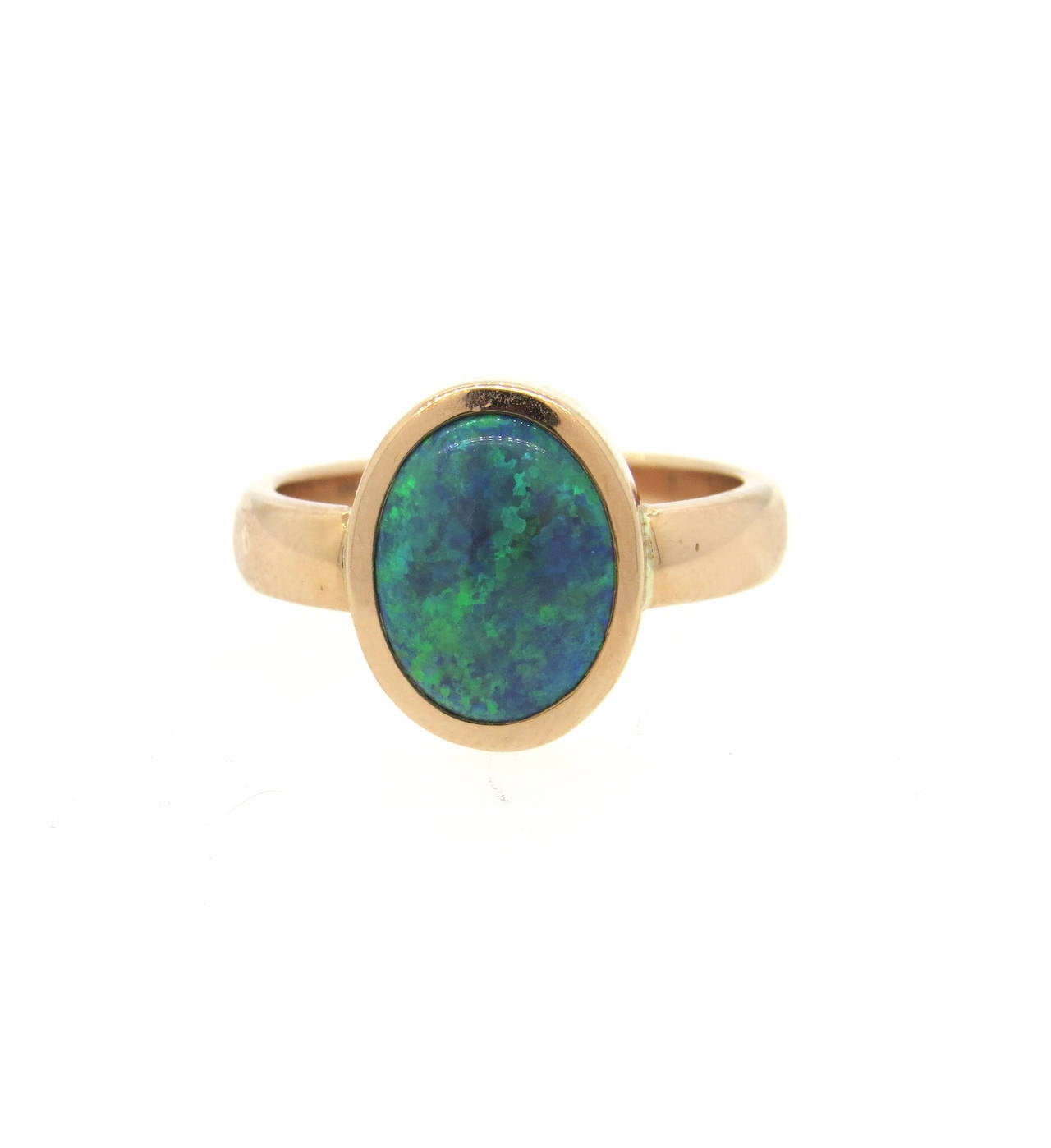 Lorraine Schwartz 18k rose gold ring, featuring 12.2mm x 9.3mm opal gemstone. Ring is a size 9 1/4, ring top measures 15mm x 12mm. Marked with maker's initials and 18k. Weight of the piece - 8.6 grams