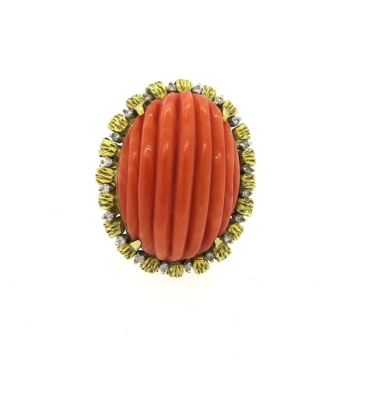 Vintage 18k gold ring, set with 25mm x 17mm carved coral in the center, surrounded with diamonds. Ring is a size 7 1/2, ring top is 28mm x 23mm. Weight of the piece - 20.2 grams