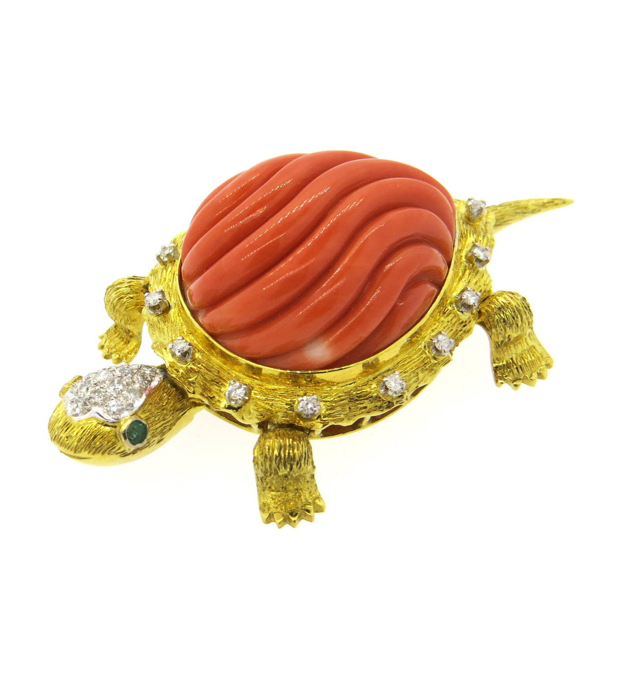 Imressive 14k brushed gold turtle brooch with movable appendages, set with 29mm x 24mm carved coral top, decorated with approximately 0.60ctw in diamonds and emerald eyes. Brooch measures 62mm x 35mm.  Weight of the piece - 35.2 grams