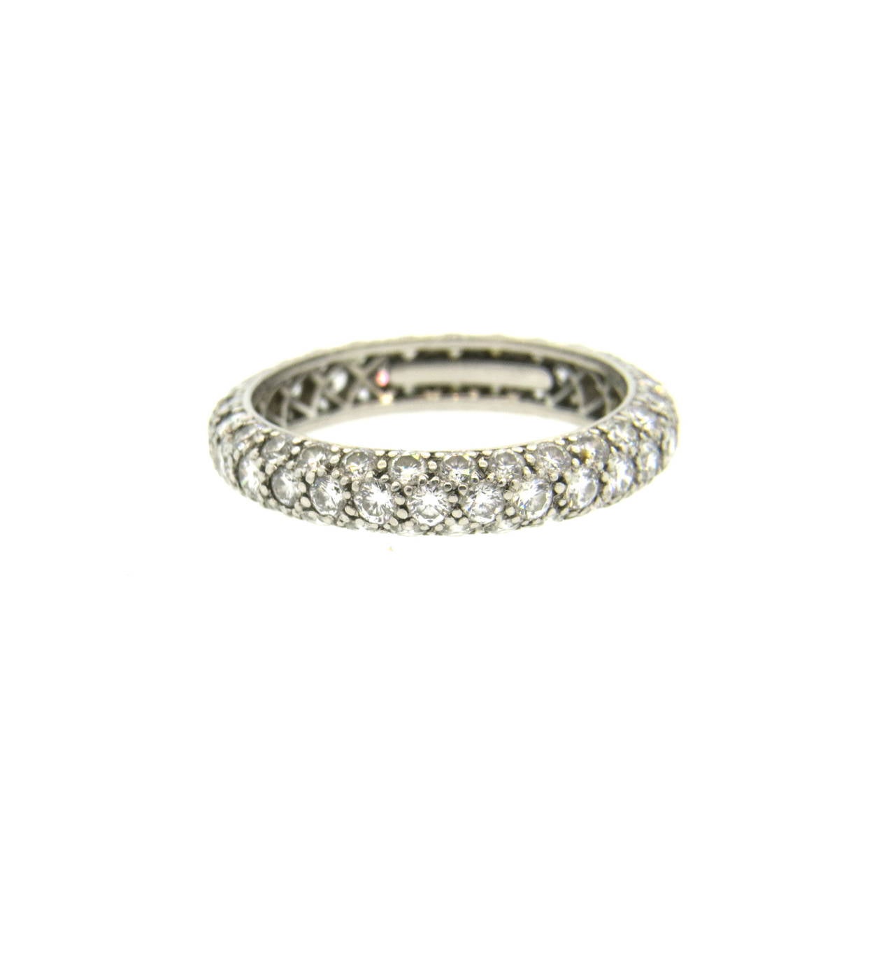 Stunning platinum eternity diamond ring from the Etoile collection from Tiffany & Co. Diamonds total approximately 1.80ctw. Ring size 6, band measures     3.8mm wide. Marked Tiffany & Co. PT950. Weighs 3.3 grams. 
Currently retails for $9,400