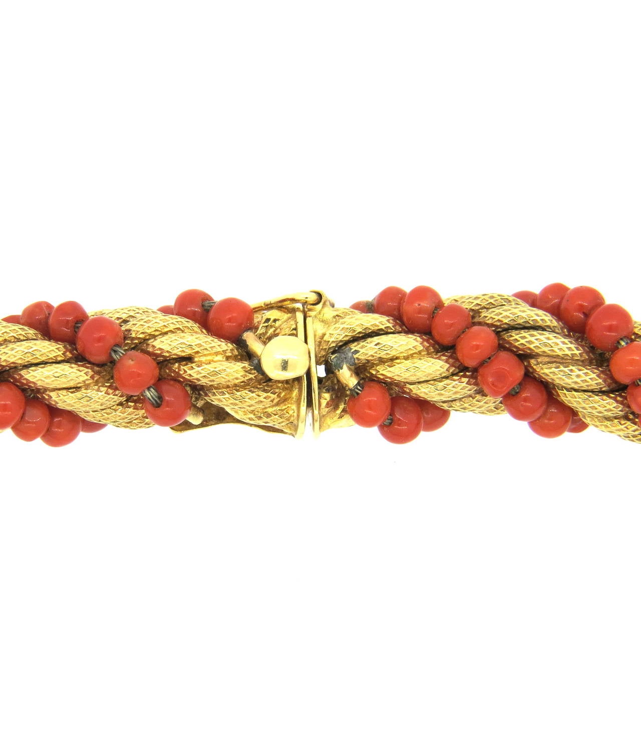 Beautiful Italian 14K gold necklace, circa 1960s, featuring coral beads in a twisted rope design. Necklace measures 16