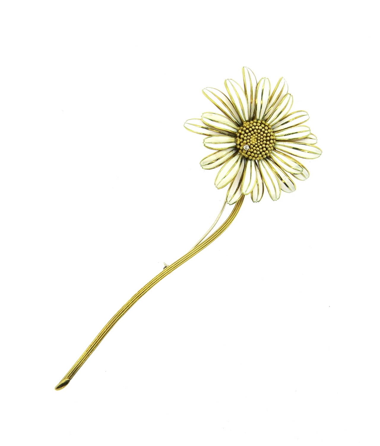 Lovely 18K gold daisy brooch featuring a single diamond. Brooch measures 140mm, top of flower is 55mm in diameter. Marked 750, weighs 41.8 grams.