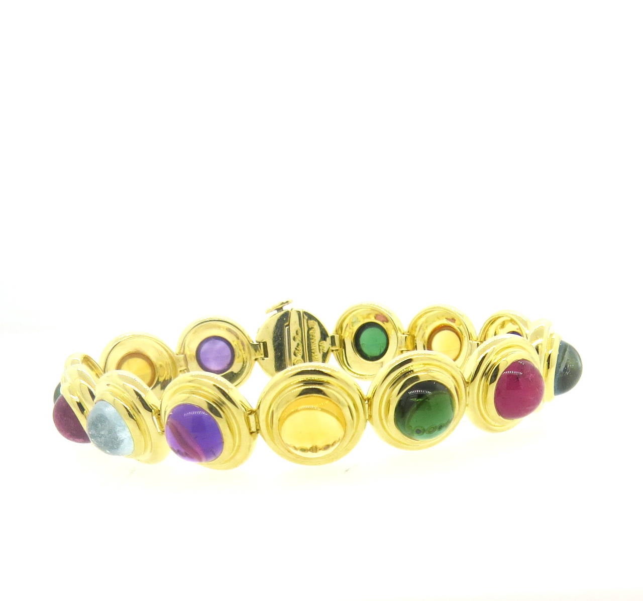 18k yellow gold bracelet, crafted by Paloma Picasso for Tiffany & Co, featuring multicolor gemstone cabochons :aquamarine, green and pink tourmaline, amethyst, citrine, peridot. Bracelet is 7