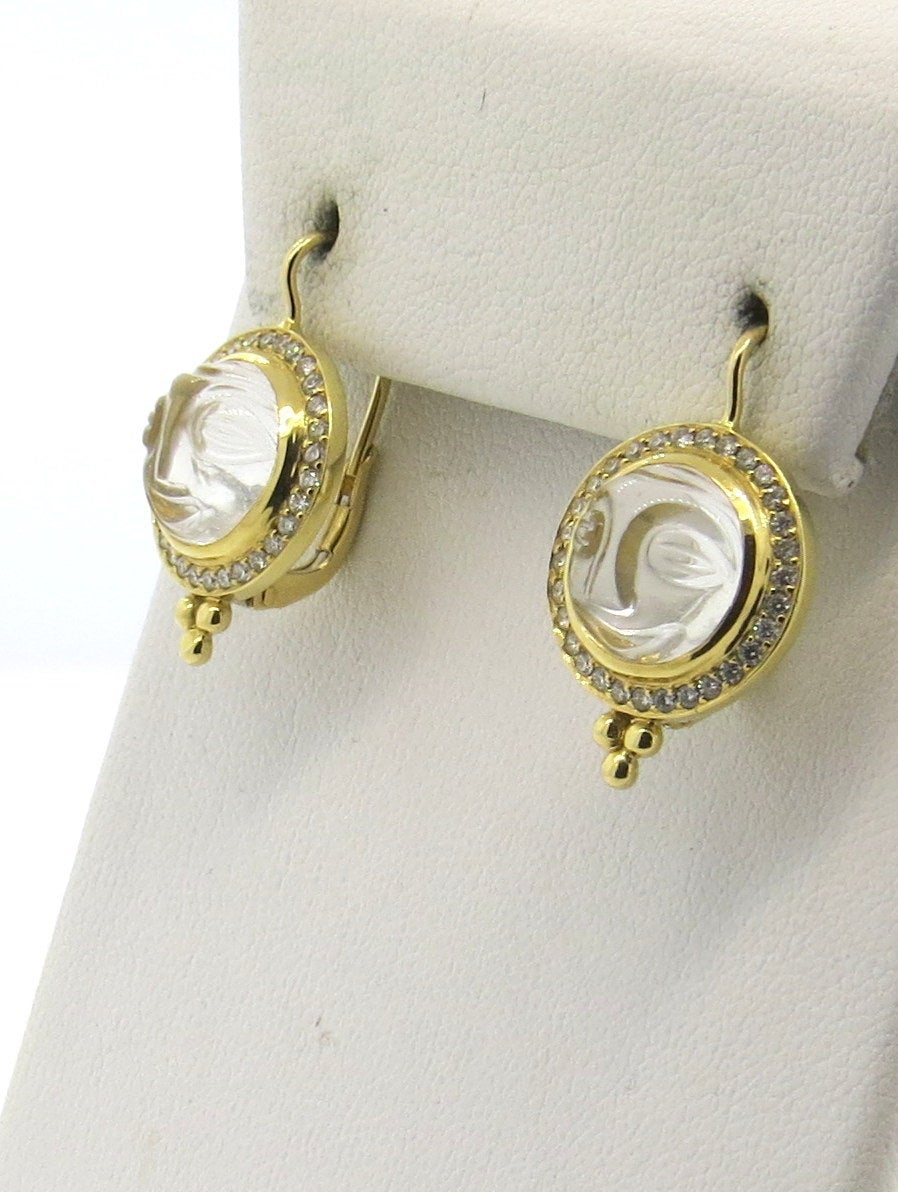 New pair of 18k gold drop earrings, crafted by Temple St. Clair, featuring moonface carved crystals, surrounded with 0.51ctw in diamonds. Earrings are 25mm long with wire, bottoms are 15mm in diameter. Marked with Temple hallmark and 750. Weight -