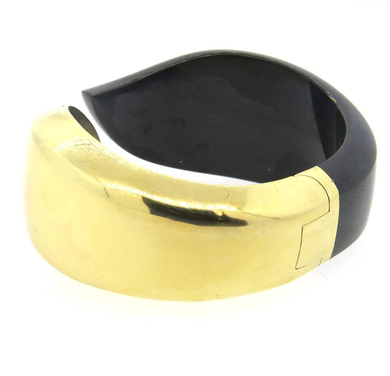 An 18k yellow gold and black onyx bracelet crafted by Elsa Peretti for Tiffany & Co.  The bracelet comfortably fits up to a 7