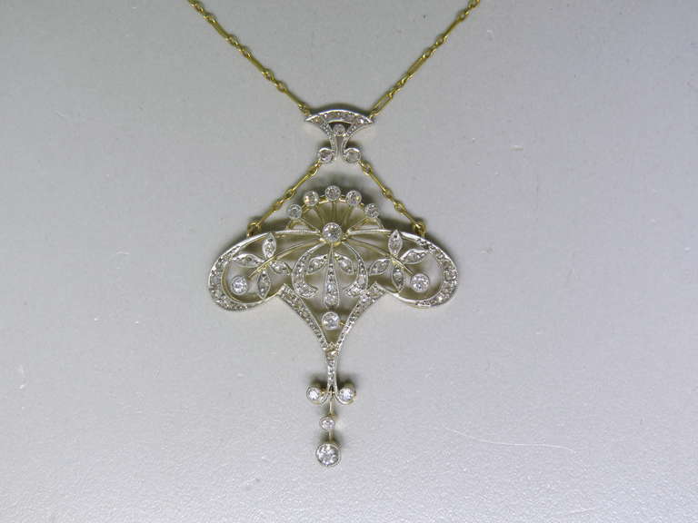 Antique 18k gold and platinum necklace with lavalier pendant,featuring approx. 1.20-1.30ctw diamonds. Necklace is 18