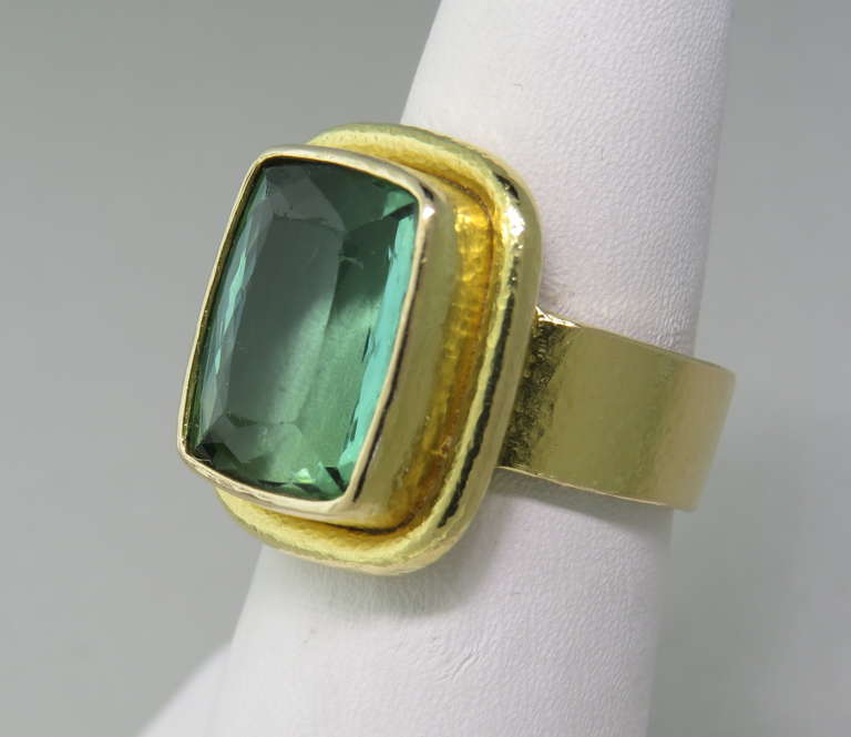 18k gold ring by Elizabeth Locke with faceted green tourmaline gemstone. Ring size 6 1/2, ring top is 19mm x 16mm.  Marked with Locke mark and 18k. weight - 13.6g