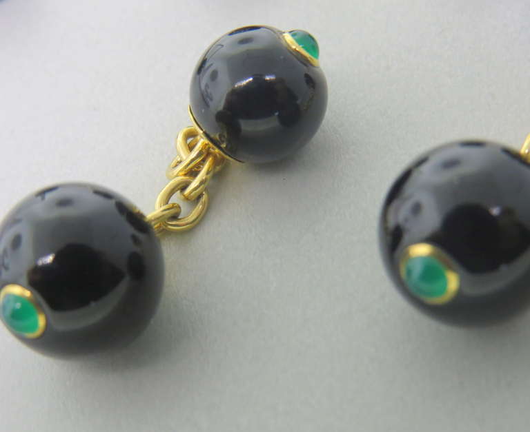 18k gold cufflink and stud set by Trianon with onyx and emerald cabochons. Cufflink onyx balls measure - 12.2mm and 9.9mm in diameter. Stud onyx ball is 9mm in diameter. Marked Trianon,750. weight - 15.7g