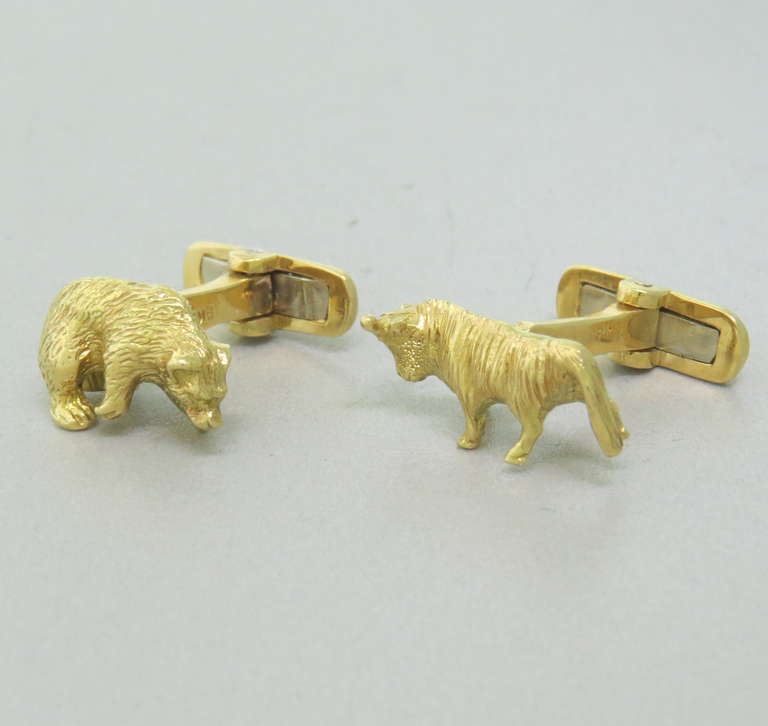 18k Gold Bull and Bear Cufflinks.  Perfect for anyone in the financial industry.  Bull measures 19.5mm x 9mm, Bear measures 16.5mm x 10mm.  The weight of the cufflinks is 18.0 grams