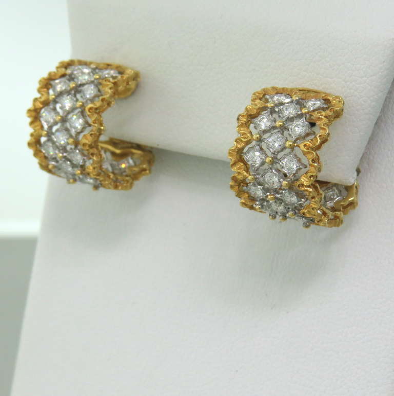 A classic and intricate pair of 18k gold and diamond earrings by Buccellati.  These earrings are part of the Rombi collection and feature about 1.00ctw in diamonds.  They measure 16.4mm x 12mm and weigh 10 grams.  The current retail for these