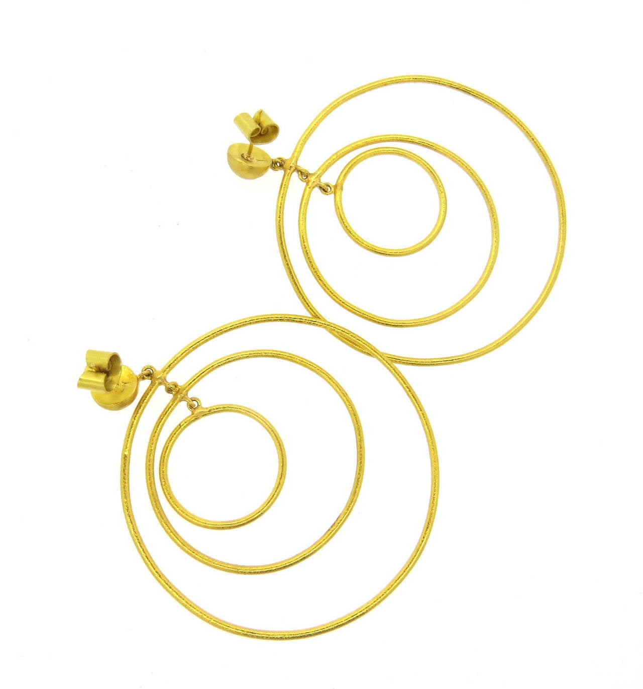 Large triple circle earrings, crafted in pure 24k gold by Yossi Harari. Earrings are 75mm long, largest circle is 62mm in diameter . Weight - 28.6 grams