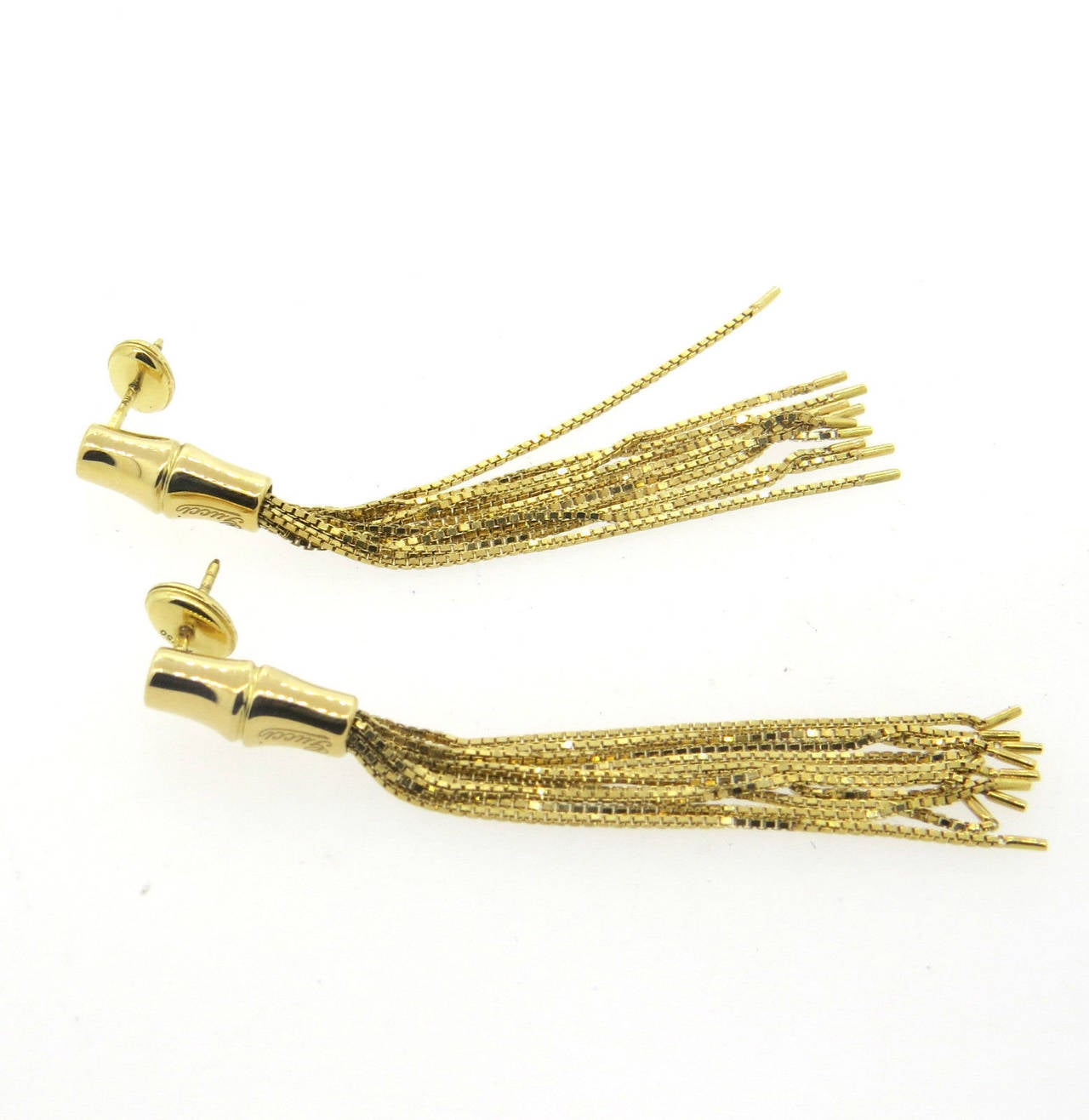 Long 18k gold tassel earrings, crafted by Gucci for Bamboo collection. Earrings are 65mm long x 6.2mm at widest points. Weight - 9.6 grams
Retail for $2990