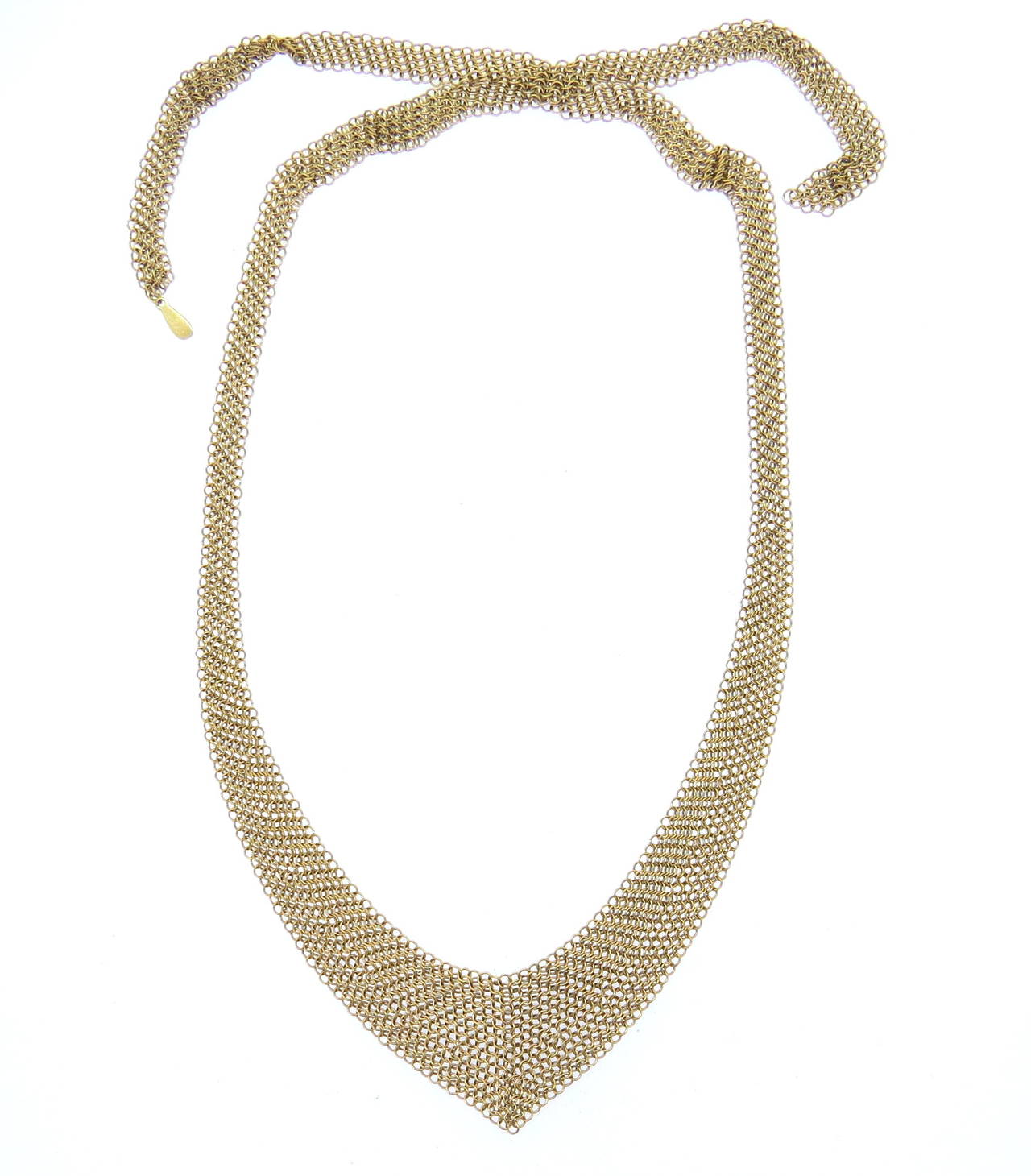 An 18k yellow gold mesh necklace designed by Elsa Peretti for Tiffany & Co.  The necklace measures 26
