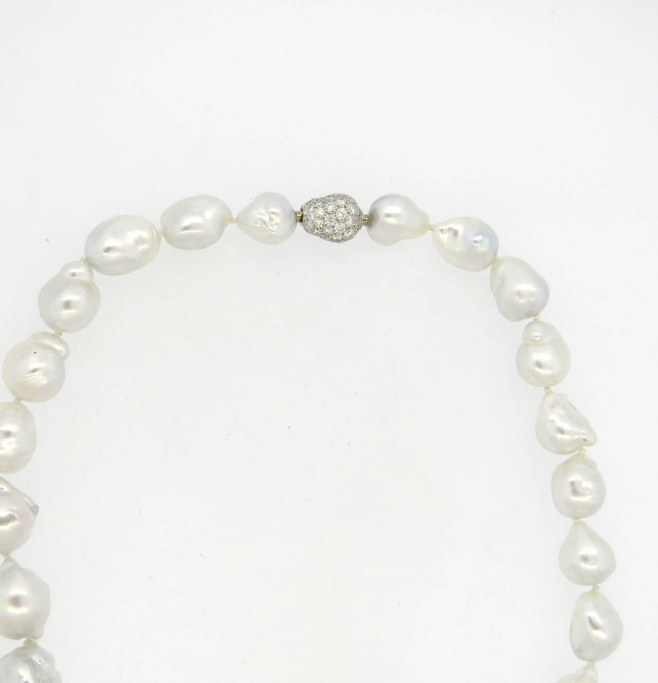 A necklace featuring graduated south sea baroque pearls ranging in size from 13.8mm x 12mm to 18mm x 18.6mm and an 18k white gold clasp set with approx. 1.30ctw of G/VS diamonds.  The necklace weighs 72.1 grams and measures 17