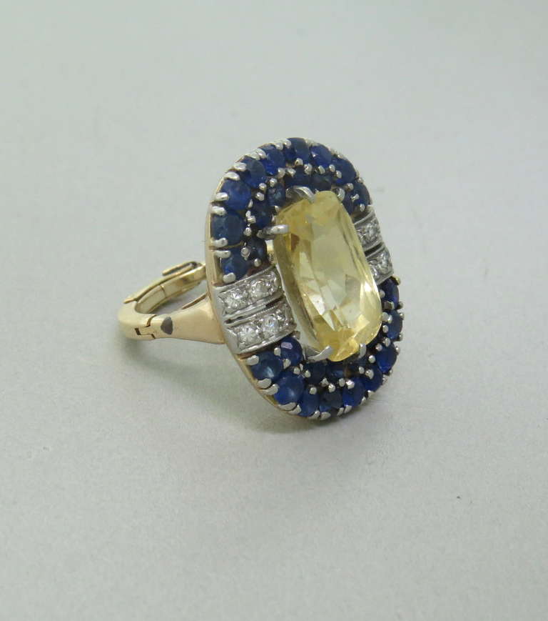 Certified 7.18ct natural no heat yellow sapphire,measuring 14.46mm x 9.04mm x 7.38mm, surrounded by two rows of blue sapphires and diamonds. Ring has an arthritis shank, size 6. Top of the ring is 25mm x 21mm. weight - 13.7g