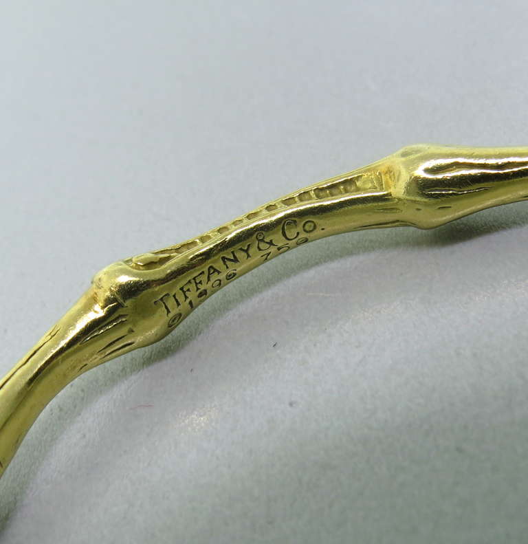 Created in 1996, this signature Bamboo 18k gold bracelet will fit an average size wrist, up to 7