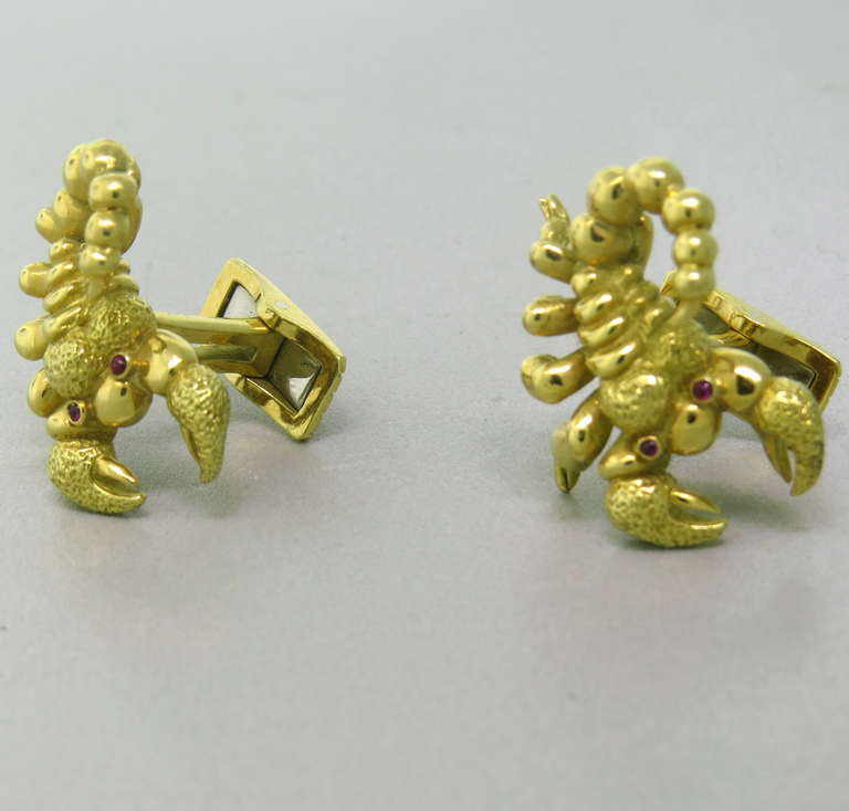 Large 18k gold cufflinks featuring scorpions with ruby eyes. Cufflink top is 26mm x 22mm. Weight 27.3g.