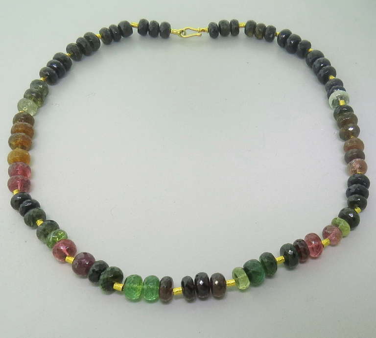 Multicolor tourmaline gemstone beads, measuring 8.8mm to 10.6mm, separated by gold spacers. Necklace is 20 3/4