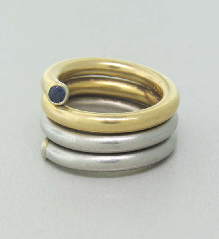 18k gold and platinum wrap around ring with diamond and sapphire. Ring size 5 3/4, ring is 14mm at widest point. Weight - 26.7g.