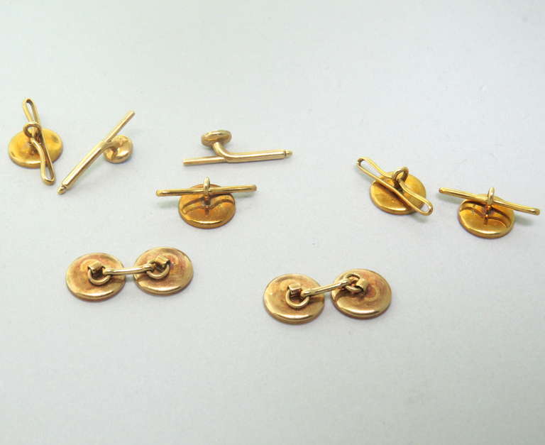 Art Deco circa 1920s 14k gold cufflink and stud set with onyx. Cufflink top is 12.2mm in diameter, stud is 12.2mm in diameter, small stud - 7mm in diameter. Weight of the set - 17.3g.
