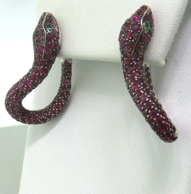 18k White Gold Ruby Emerald Snake Earrings.  The earrings measure 36mm x 18mm and weigh 24.8 grams.

Approximate Current Retail In Boucheron is $80,000.