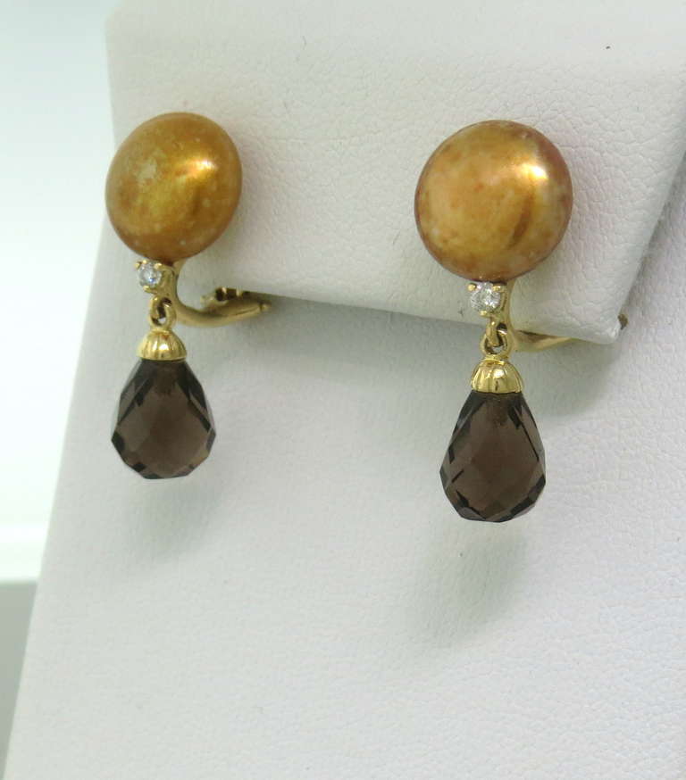 18k gold earrings by Trianon,featuring smokey topaz drop, gold pearl and diamonds. Earrings are 26mm long, pearls are 11.4mm in diameter. Marked 750 and Trianon mark. weight - 8.2g