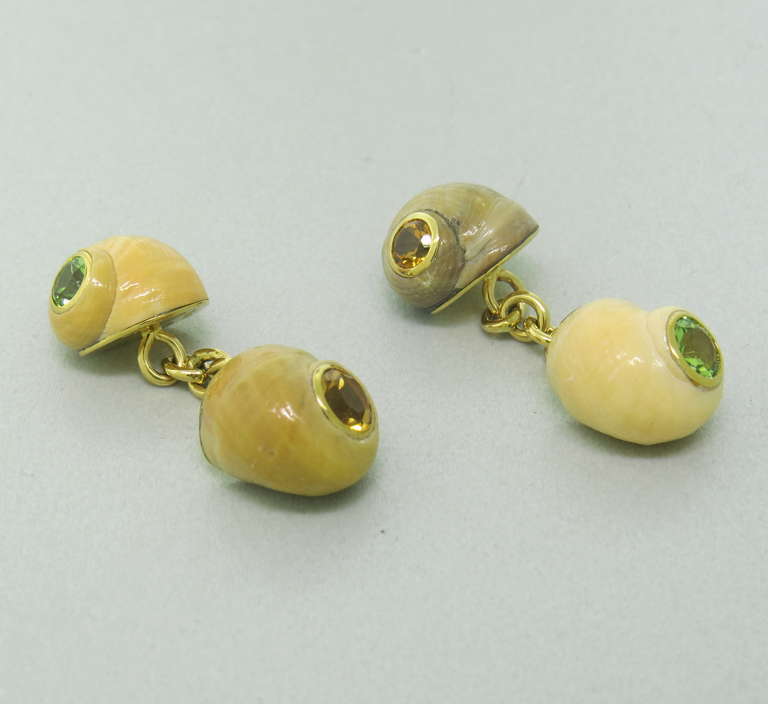 Sea Shell Cufflinks with Peridot and Citrine set in 18k yellow gold.  Shells measure 12mm x 10mm.  The weight of the cufflinks is 7.6 grams.