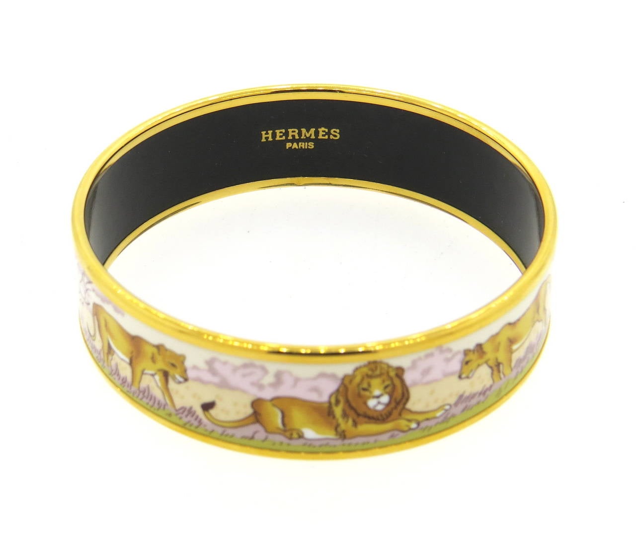 Exquisite lion and lioness enamel bangle bracelet by Hermes. Bangle measures 18mm wide, opening is 2.5