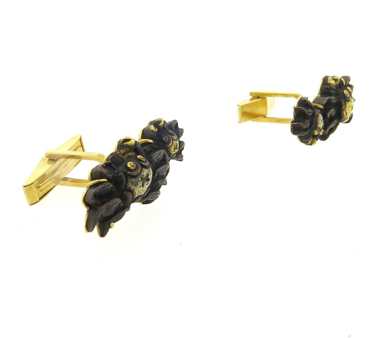 A pair of 18k gold shakudo crab motif cufflinks measuring 33mm x 14mm and weighing 21.2 grams.  Crafted by Gumps.