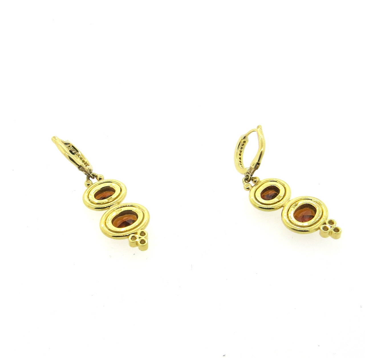 A pair of 18k yellow gold earrings set with Madeira citrine and approximately 0.22ctw of G/VS diamonds.  Crafted by Temple St. Clair, the earrings measure 41mm x 12mm and weigh 11.5 grams.  The earrings currently retail for $4950