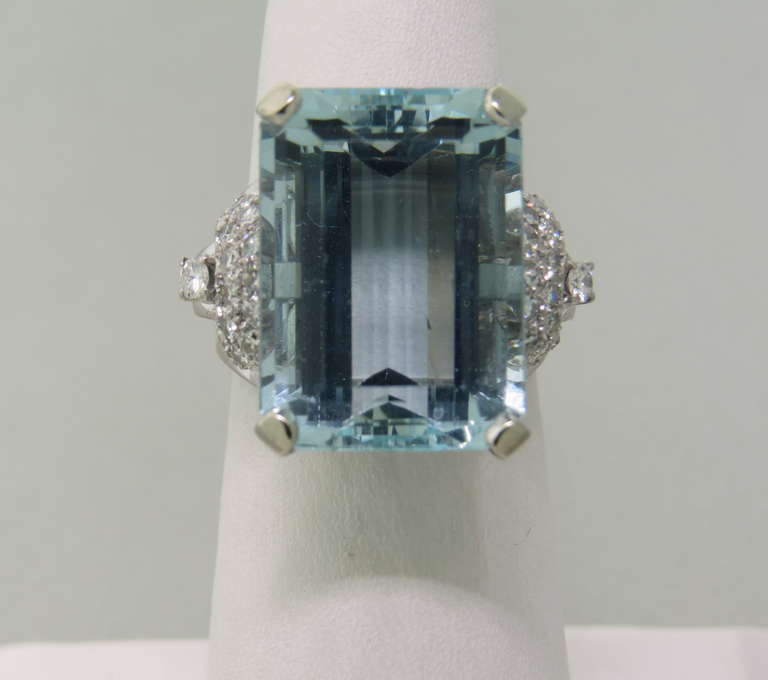 Beautiful approximately 22.5ct aquamarine gemstone,measuring 28.1mm x 13.1mm x 8.9mm, set in platinum and surrounded with approx. 0.40-0.50ctw diamonds. Ring size 5 1/2, ring top is 28mm x 22mm. weight - 11.2g