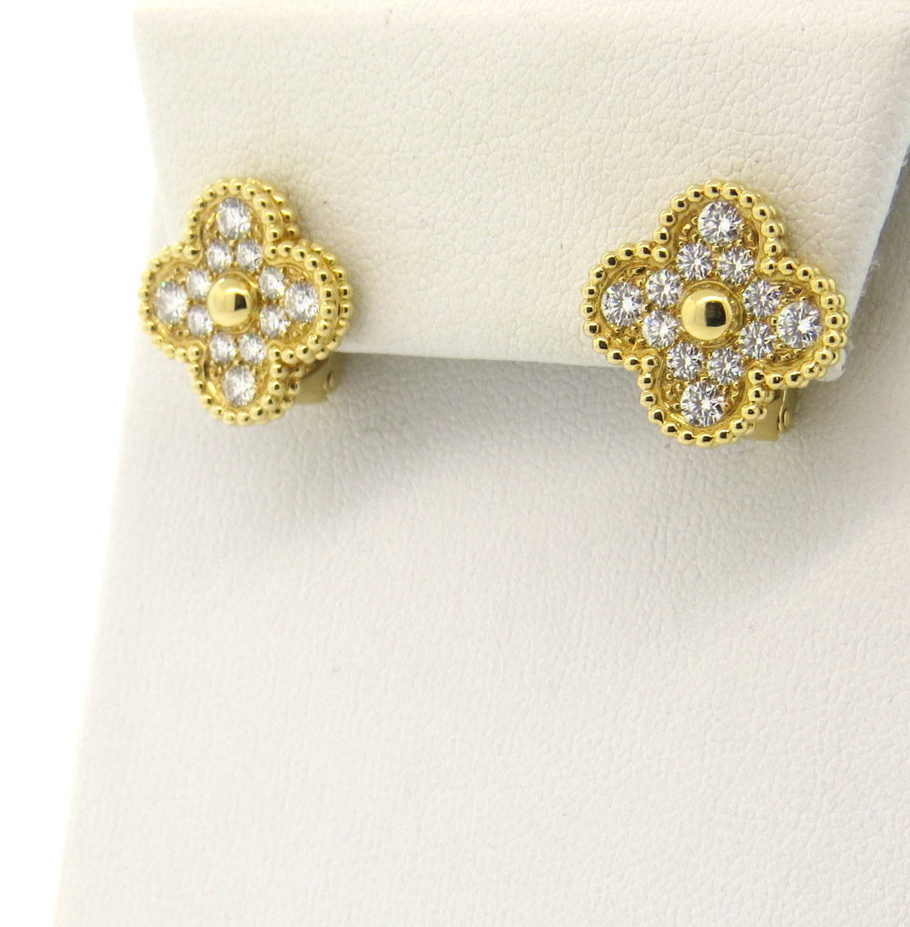 A pair of 18k yellow gold diamond earrings set with approximately 0.97ctw of F-G / VVS diamonds.  Crafted by Van Cleef & Arpels for the Vintage Alhambra Collection, the earrings measure 15mm x 15mm and weigh 9.2 grams.  The earrings currently retail