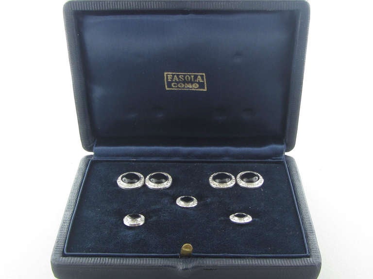 Original 18k gold cufflink and stud set, featuring approx. 1.00ctw in diamonds and onyx. :Stud Face - 10mm In Diameter, Cufflink Face - 13mm In Diameter . weight of the set - 18.4g