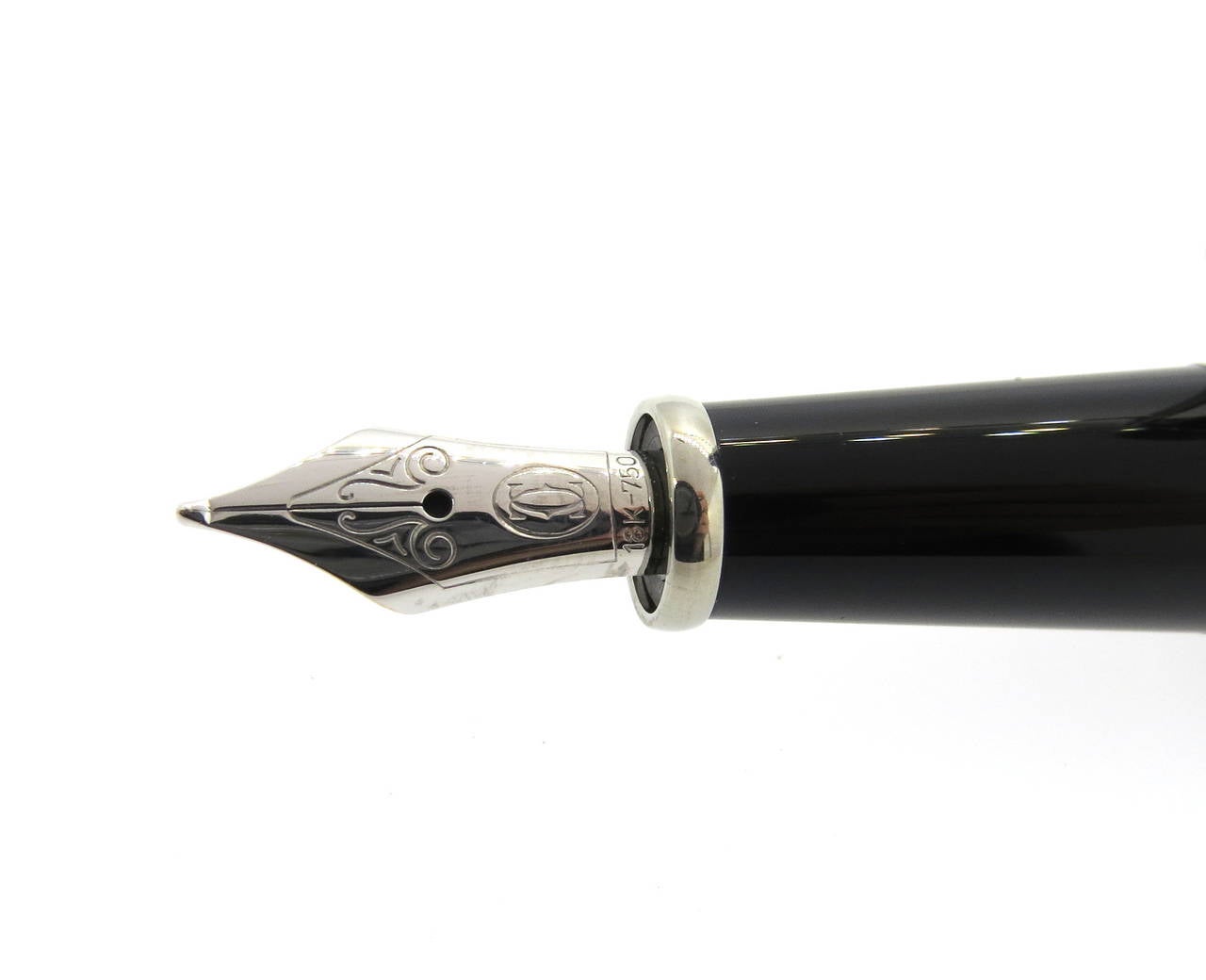 Classic Cartier Diabolo fountain pen with a black composite body and palladium finishes as well as a jeweler's sapphire cabochon on the cap. Pen measures 142mm long and features an 18K gold nib. Pen is a brand new in store sample, comes with