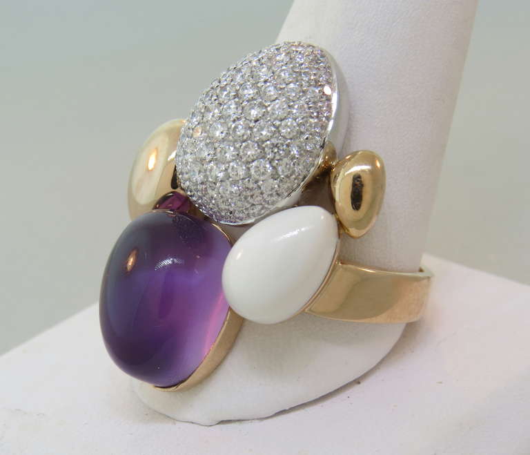18k rose gold ring by Roberto Coin,featuring diamonds,amethyst cabochon and white gemstone. Ring size 12, ring top measures 32mm x 25mm. Marked with signature ruby,Italy and 18Kt. weight of the ring - 17.3 gr