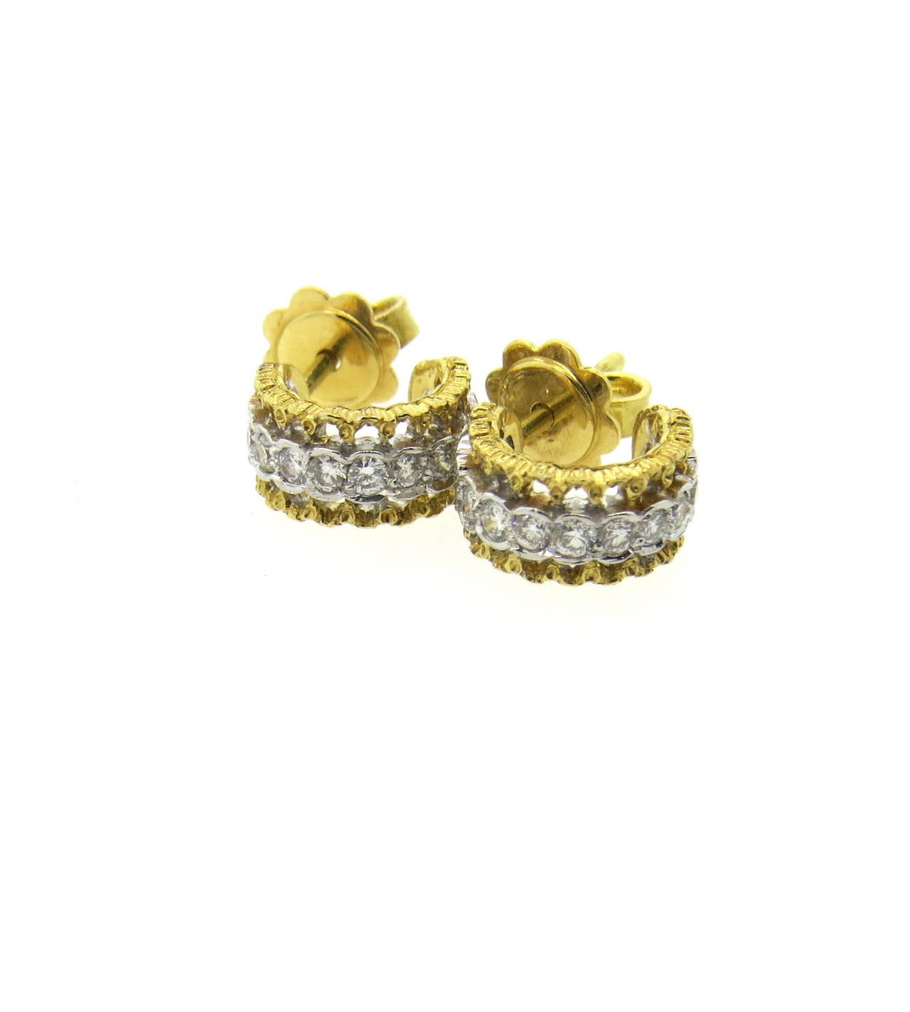 A pair of 18k yellow gold small hoop earrings set with 0.50ctw of G/VS diamonds.  Crafted by Mario Buccellati, the earrings measure 10mm x 5mm and weigh 3.9 grams. Comes with Buccellati box.
