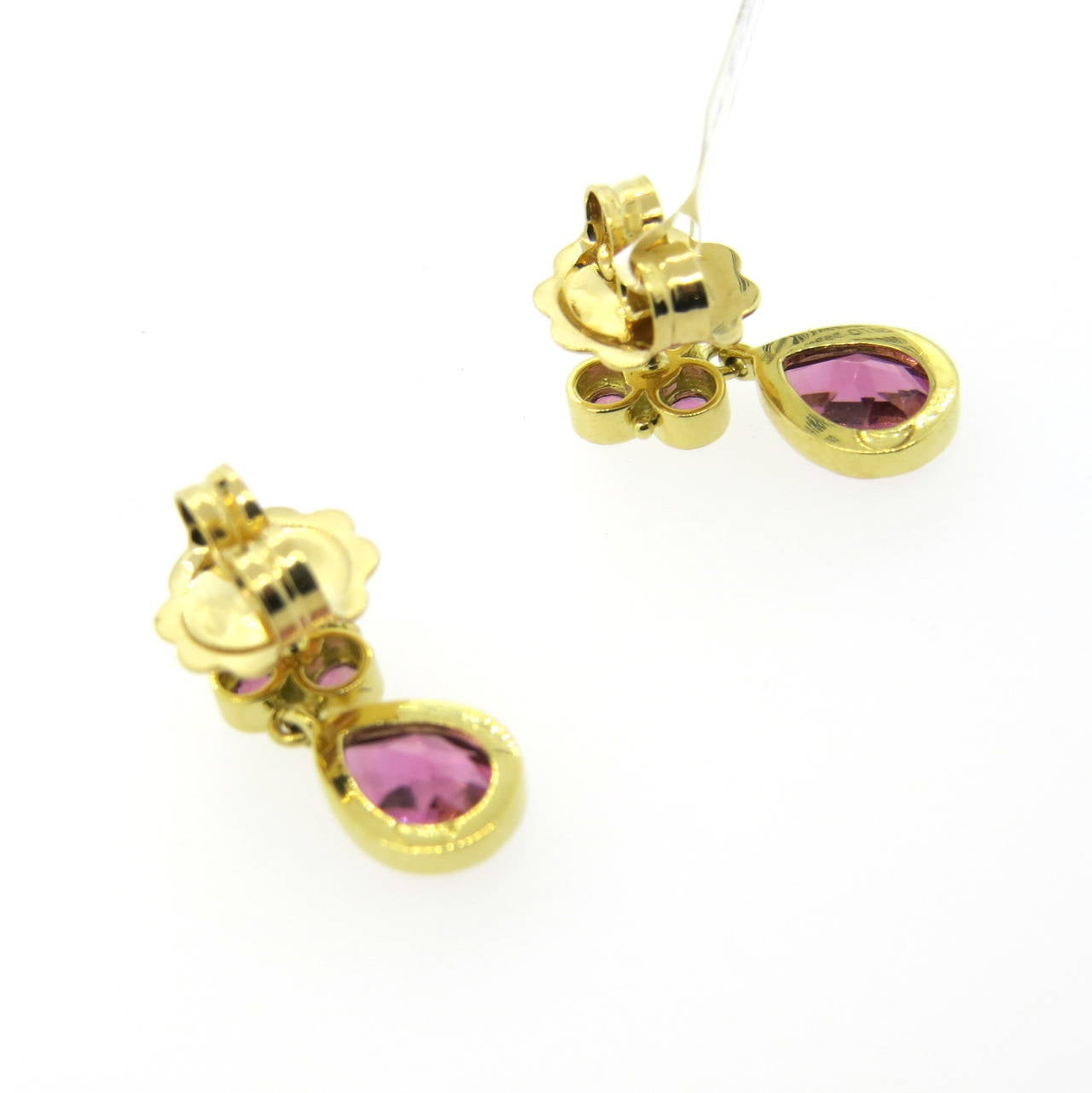 A pair of 18k yellow gold earrings set with 2.62ctw of pink tourmalines.  Crafted by Temple St. Clair, the earrings measure 19mm x 7mm and weigh 5.1 grams.