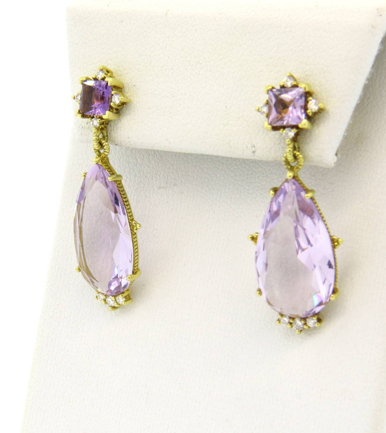 A pair of 18k yellow gold earrings set with approximately 0.16ctw of G/VS diamonds and faceted amethyst.  Crafted by Judith Ripka, the earrings measure 37mm x 13mm and weigh 7.9 grams. Marked: JR, 18k