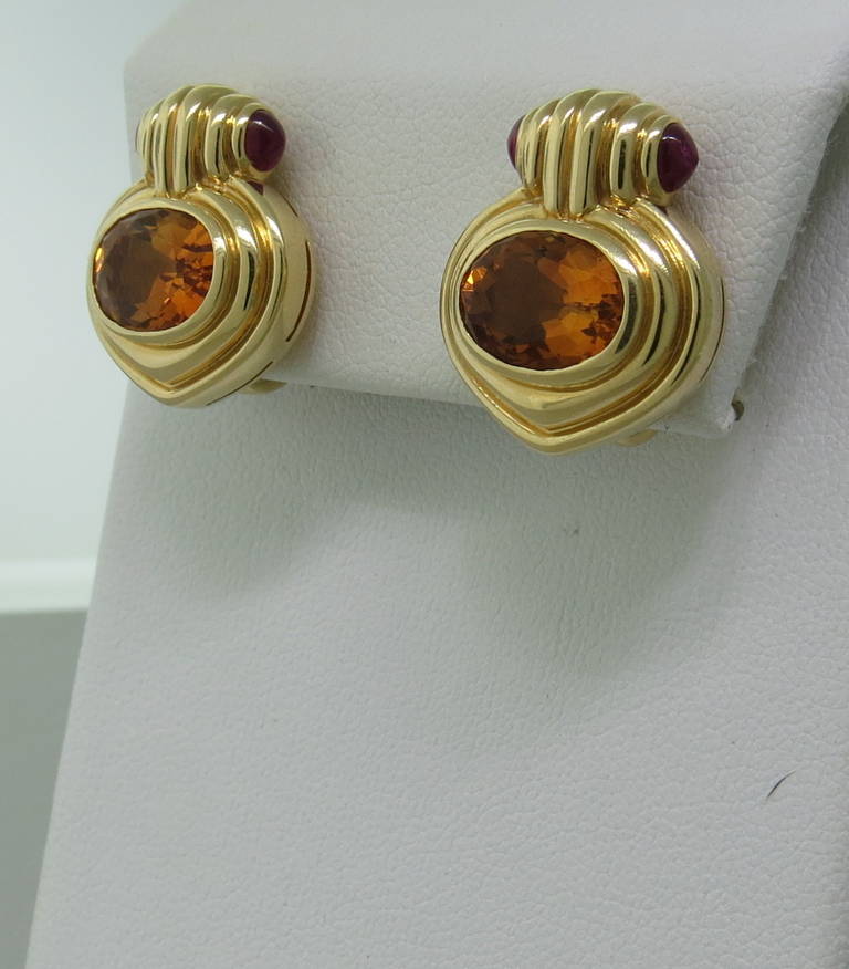 Bulgari 18k gold earrings with faceted citrine stones and two ruby cabochons each. Earrings are 20mm x 17mm. Marked Bvlgari,750. weight - 20.2gr