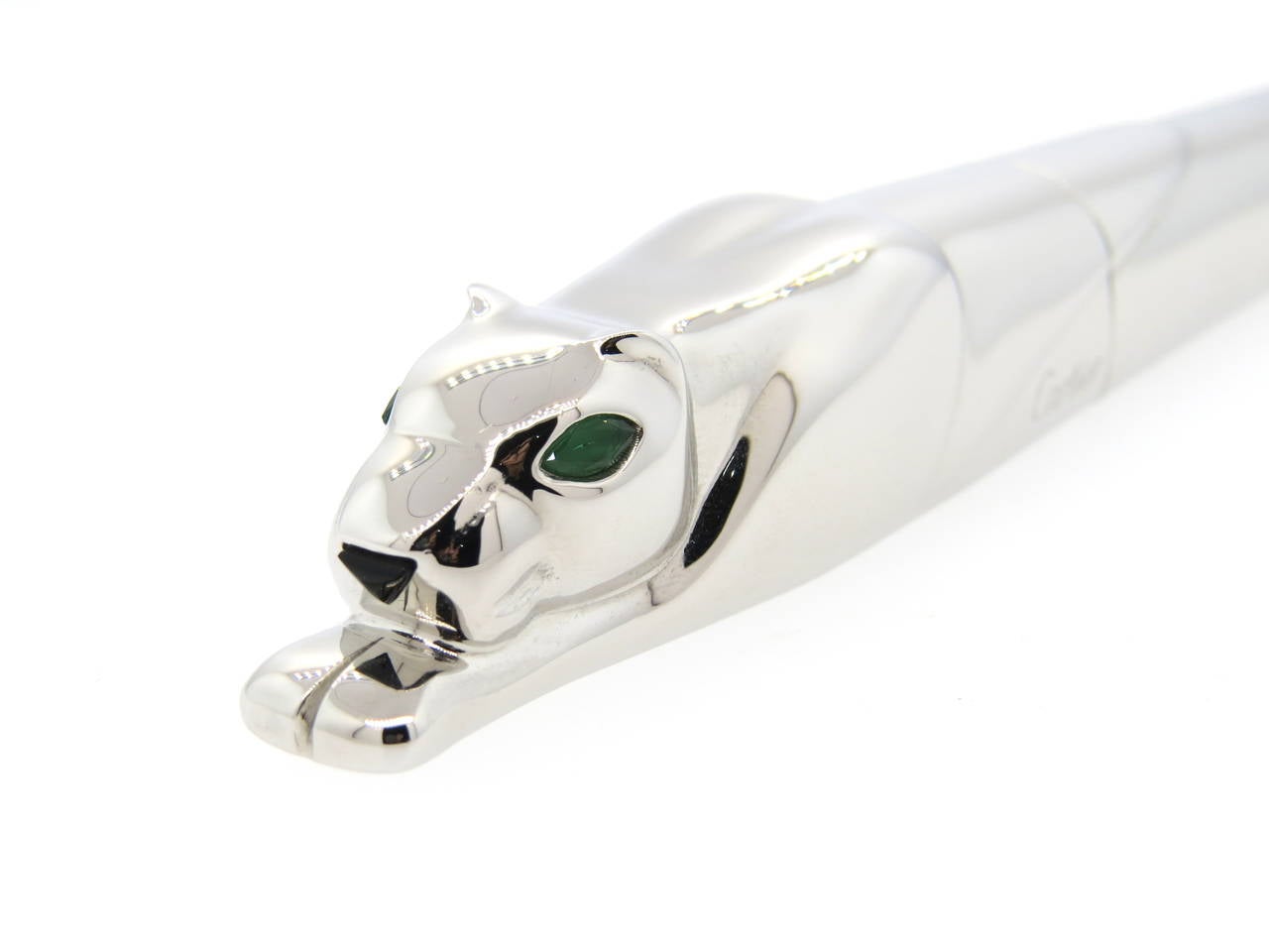 Signed Cartier, Panthere de Cartier, Model number 291/500, circa 2000. Sterling silver barrel and cap realistically crafted as a crouching panther with green glass-set eyes and onxy-set nose, 18k white gold nib, signed and numbered. Measures 156mm