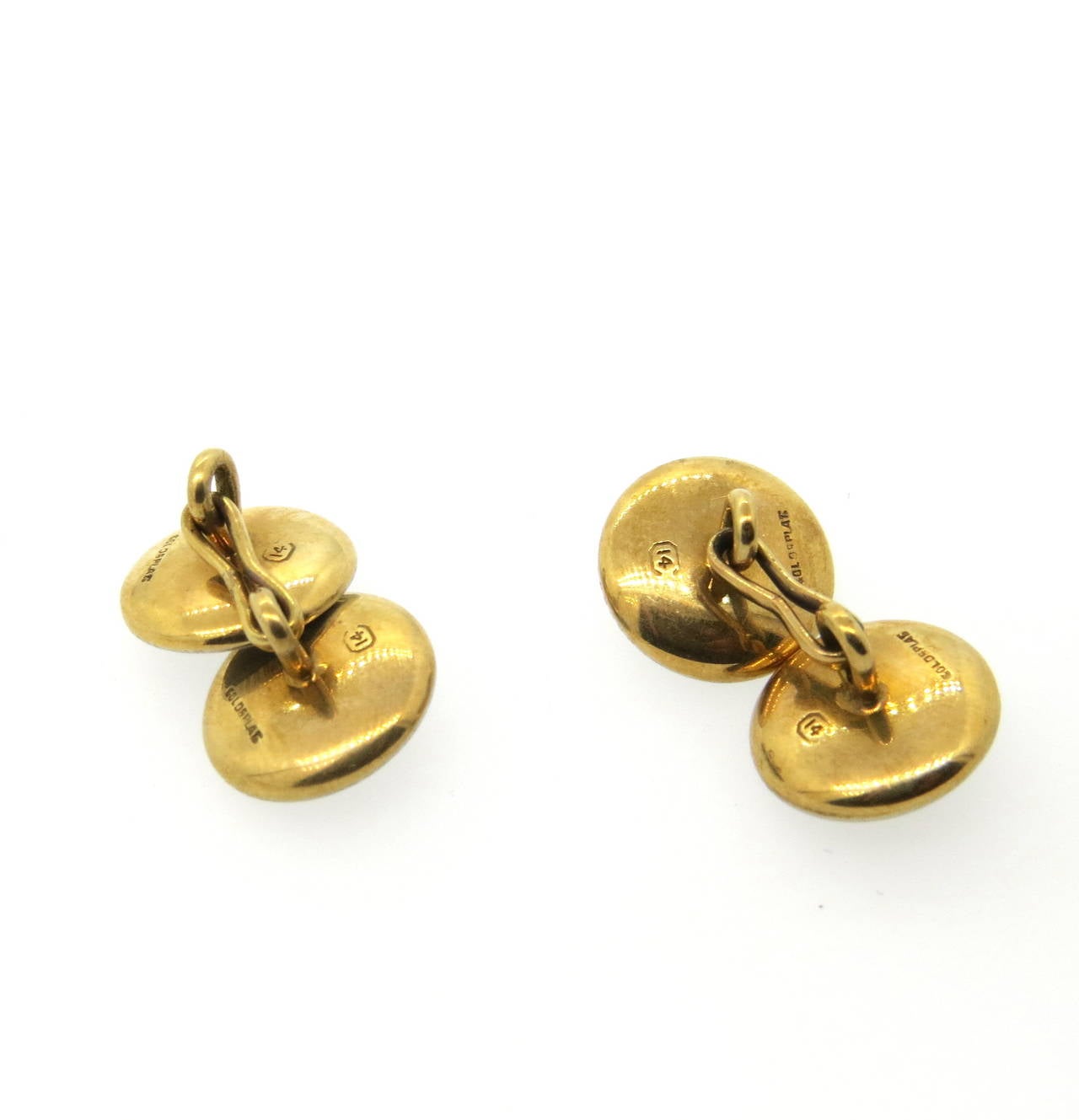 A pair of 14k gold and platinum cufflinks set with 3.5mm pearls.  The cufflinks are 14.1mm in diameter and weigh 8.7 grams.