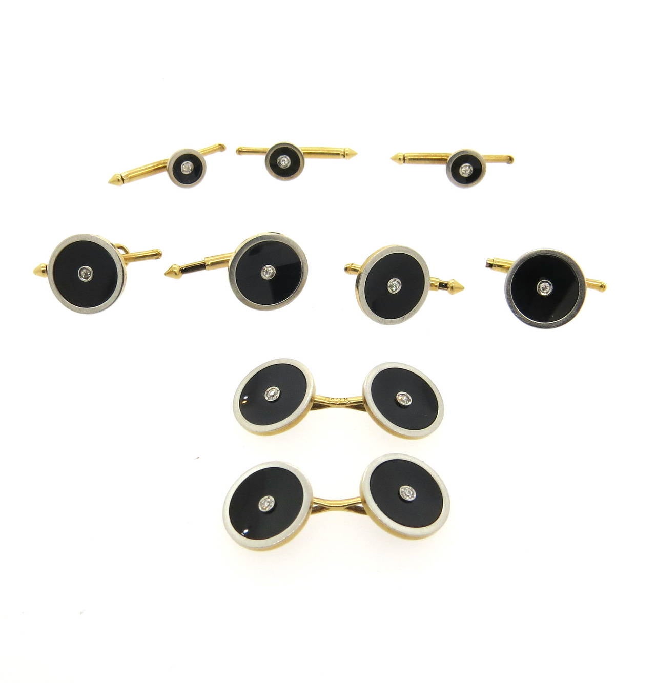 A 14k gold and onyx dress set with approximately 0.33ctw of H/VS diamonds.  The cufflinks and buttons measure 12.5mm in diameter, and the studs measure 7mm in diameter.  The weight of the set is 15.4 grams.