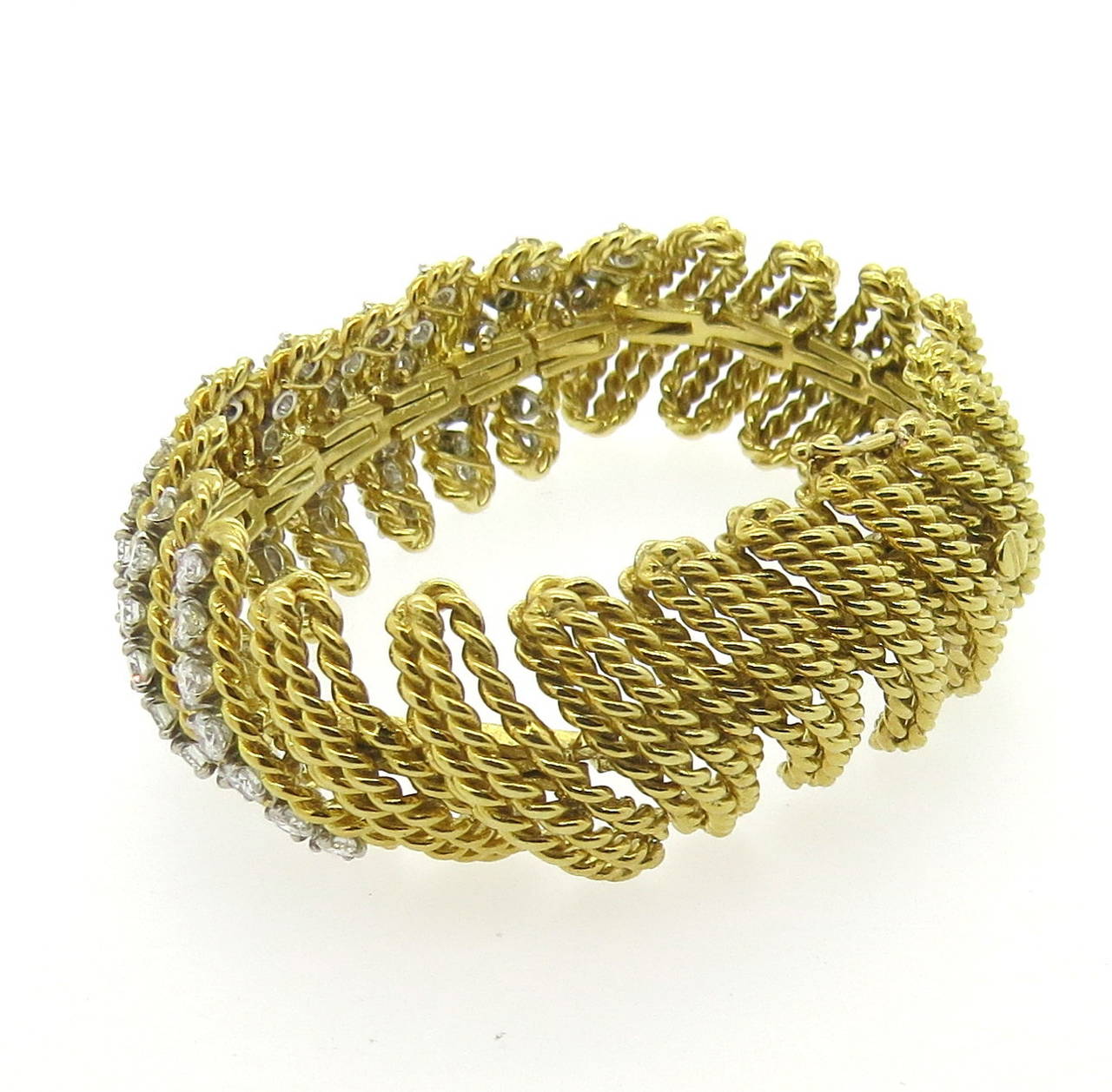 Impressive vintage 14k gold bracelet, set with approximately 7.00-7.50ctw in diamonds. Bracelet is 6 3/4