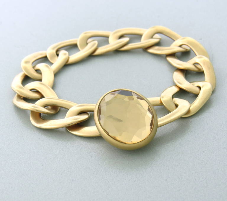 Pomellato 18k gold link bracelet with faceted rock crystal toggle closure. Bracelet is 7 3/4