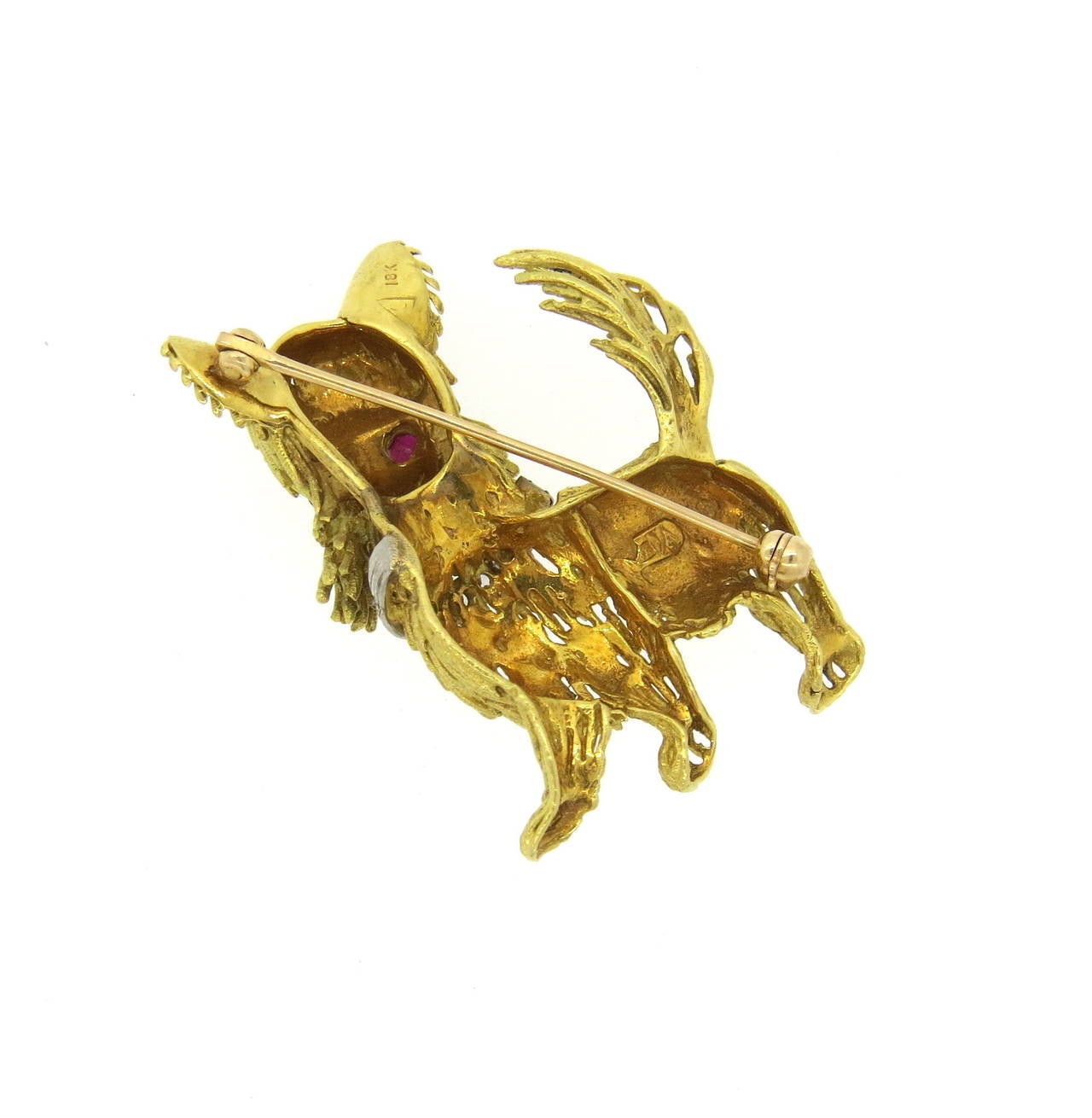 1960s 18k gold brooch pin, depicting dog, set with ruby eyes and diamond collar. Brooch measures 38mm x 30mm. Weight of the piece - 14.6 grams
