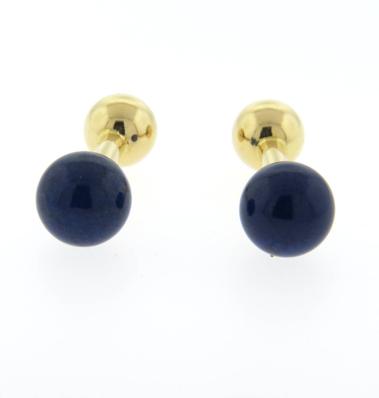 A pair of 14k yellow gold cufflinks set with lapis.  Crafted by Tiffany & Co, the cufflinks measure 11.2mm in diameter (lapis) and 9.3mm in diameter (rear off cufflinks).  They weigh 8.0 grams.  Marked: Tiffany & Co 585